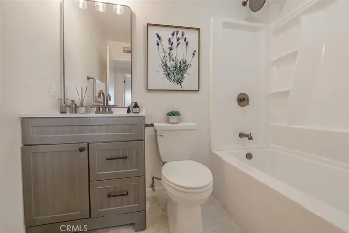 Guest Bathroom (Disclaimer: Some images have been digitally enhanced with virtual staging to illustrate potential room layouts and furnishings. Actual property condition and features may vary. Buyer to verify all information independently)