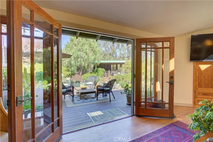 French doors to side deck & tea house