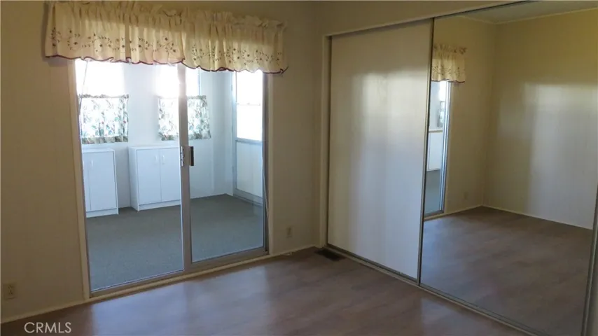 Guest Bedroom with Full wall Closet & Cabinets