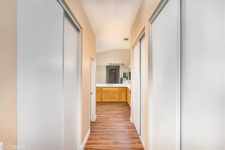 Entrance to primary bath with loads of closet space.