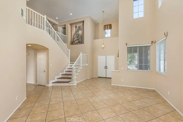 Spacious living area with double door entry.
