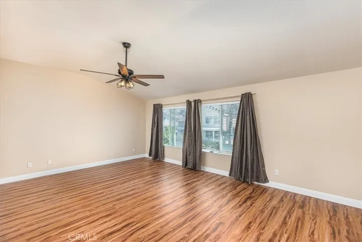 Primary suite with newer hard surface flooring.