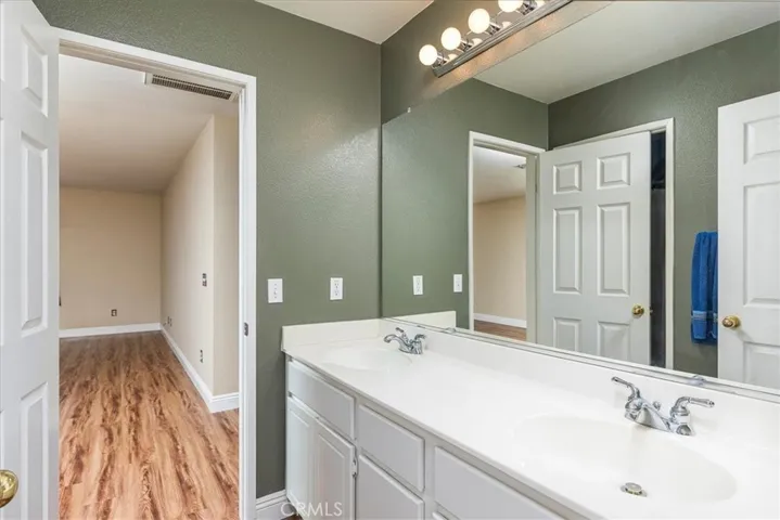 Upstairs bath with dual basins.