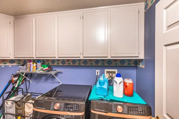 Portion of downstairs indoor laundry