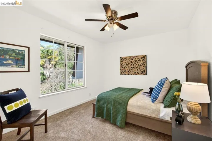 Bedroom with carpet and a ceiling fan