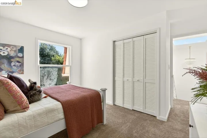 Bedroom featuring a closet and dark carpet
