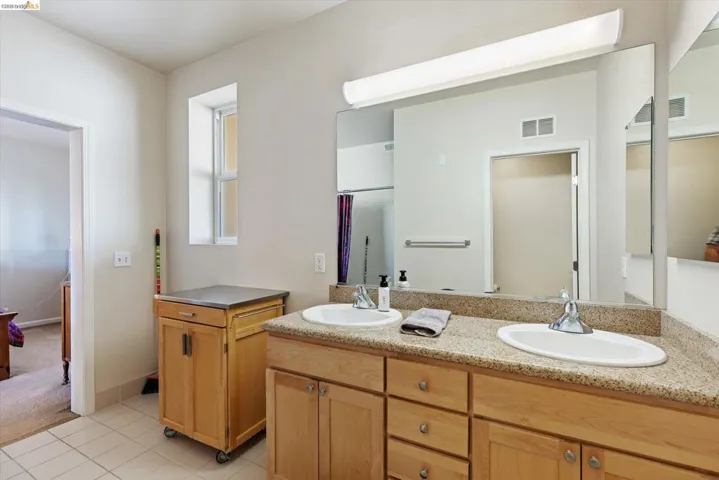 Full bathroom with double vanity,