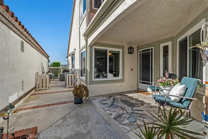 Courtyard Entry to Front Porch and Side Yard Area