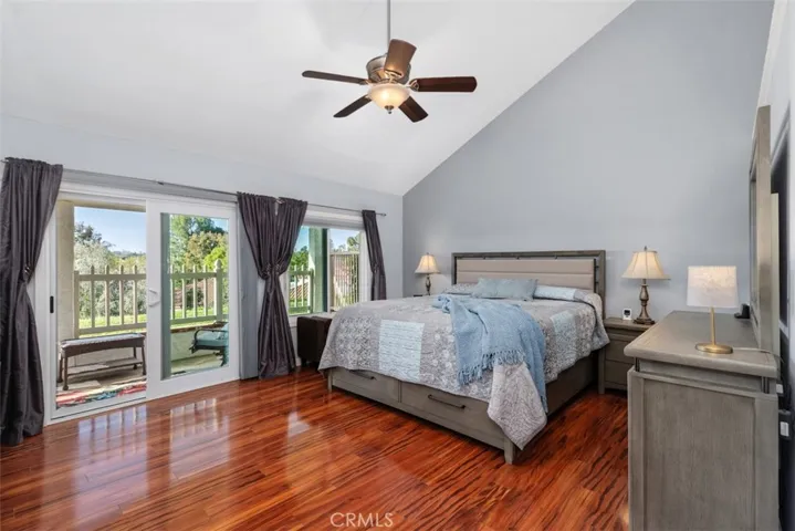 Primary Bedroom with high ceilings and direct access to backyard patio area