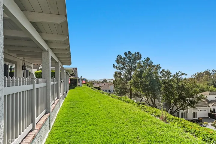 Green Belt area outside gated enclosed patio area, greenbelt area is maintained by HOA
