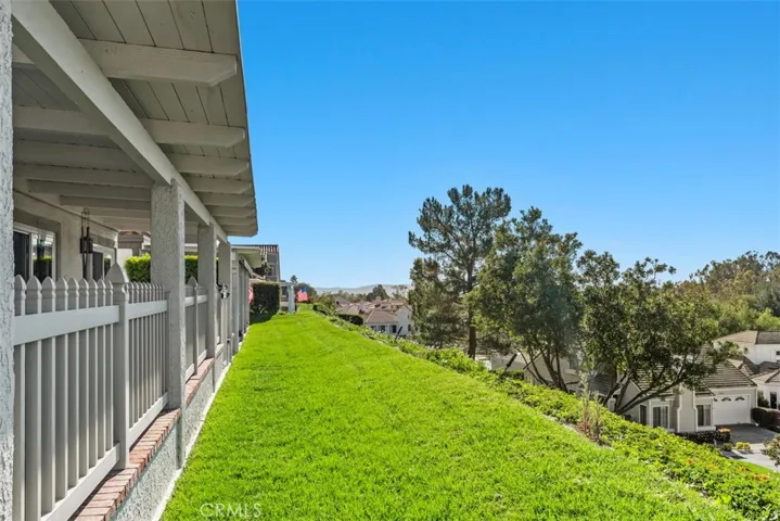 Green Belt area outside gated enclosed patio area, greenbelt area is maintained by HOA