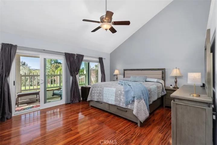 Primary Bedroom with high ceilings and direct access to backyard patio area
