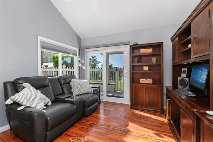 Den / Office area adjacent to kitchen with direct access to backyard patio area