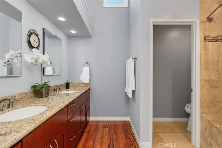 Primary Bathroom with lots of storage & separate toilet room