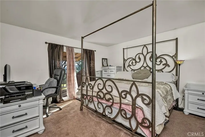 Primary bedroom has door to deck.