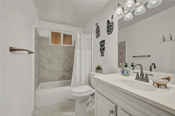 Updated hall bath with shower over tub.