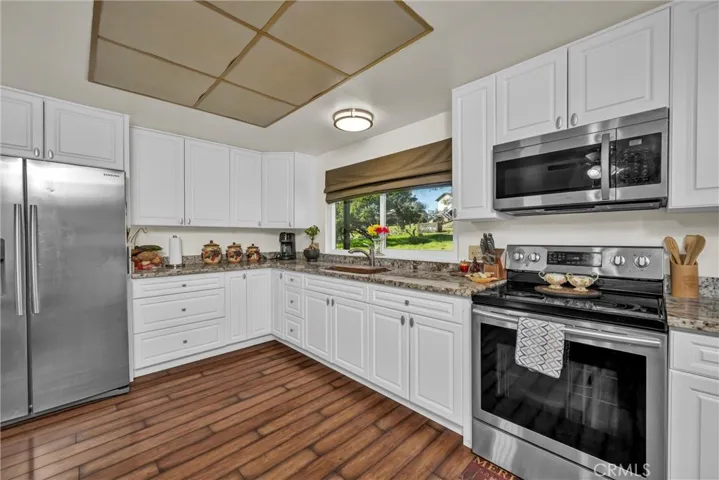 Lovely granite countertops and lots of counter space.