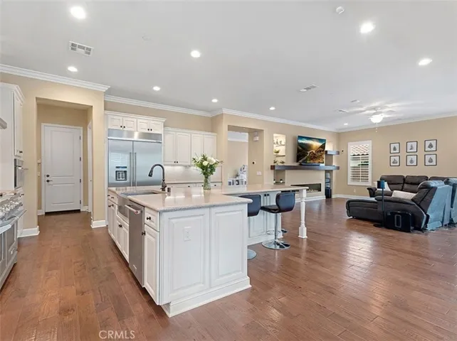 CHEF'S KITCHEN
Recessed lighting
Custom cabinetry
Granite countertops
Stainless steel farmhouse basin
Self closing drawers with organizers
Built-in trash recycling bin
Custom furniture style granite crowned center island with storage
Wrap around breakfast bar
Walk-in pantry
Stainless steel KitchenAid® dishwasher
Stainless steel KitchenAid® 6 burner double oven gas range
Stainless steel KitchenAid® wall mount ventilation hood
Built-in stainless steel KitchenAid® refrigerator/freezer
Stainles...