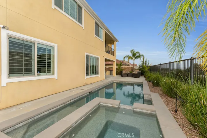 RESORT STYLE BACKYARD
Views
Fully landscaped grounds
Low maintenance evergreen turf lawn
Fruit and citrus trees
Outdoor lighting with automatic sunset activation
Covered outdoor living space
Custom built natural gas barbeque station with refrigerator
Smart app controlled heated in-ground Pebble Tec® lap pool and spa with waterfall and color changing lighting