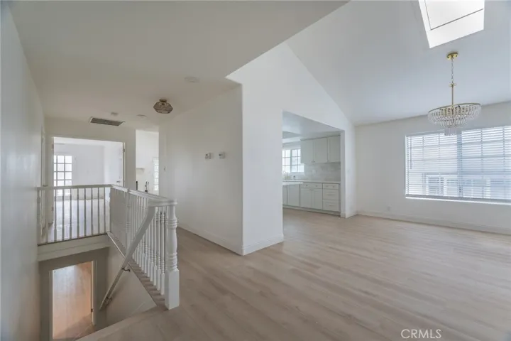 Hall Looking at Dining Room and Staircase to Lower Space