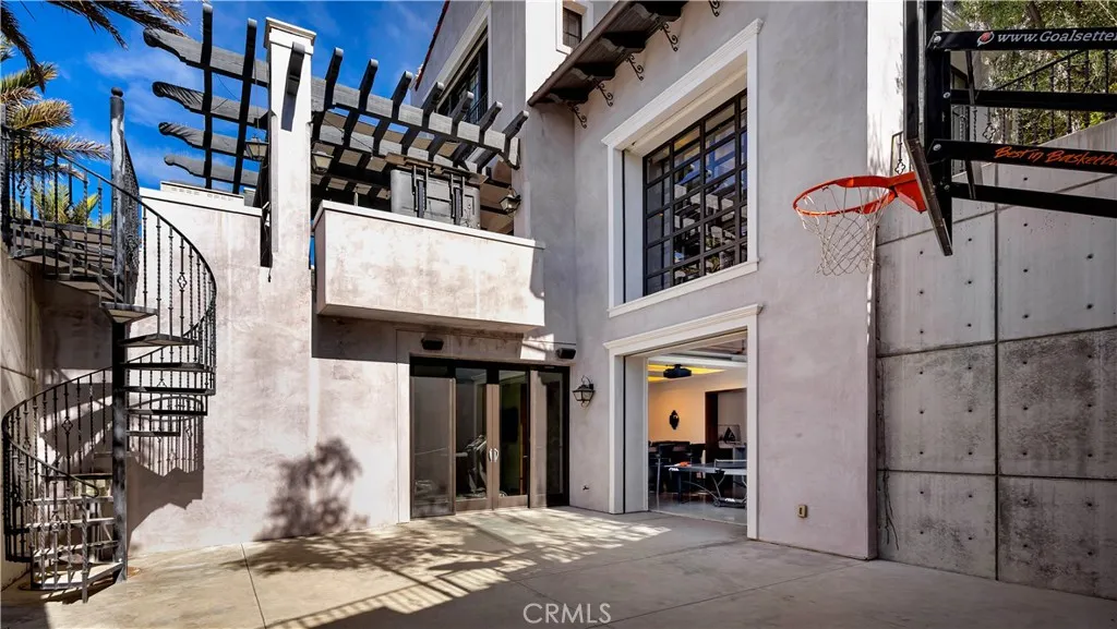 How about a competitive basketball game on your own half court? Enter the space from the game room with its unique garage door entry, your own gym or from the pool area upstairs.
