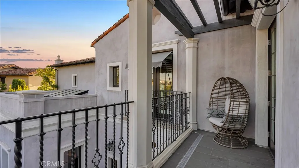 Enjoy sunset views off the private balcony attached to this bedroom.