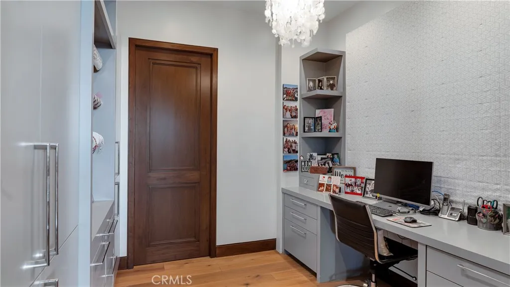 Adjacent to the breakfast area is a home management/craft room. Behind that door, is the biggest pantry you've ever seen.