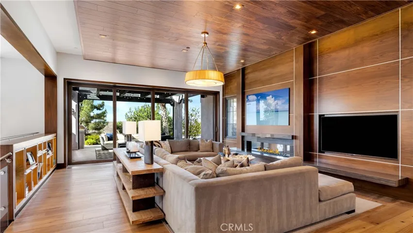 Notice the warmth of aged Mediterranean wire-brushed wood floors set against soft neutral tones throughout the home.