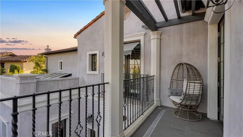 Enjoy sunset views off the private balcony attached to this bedroom.
