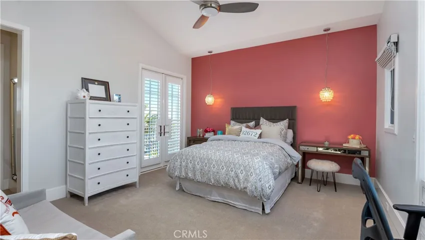 There are 3 secondary bedrooms upstairs. This bedroom has a private balcony with a stairway down to the pool.