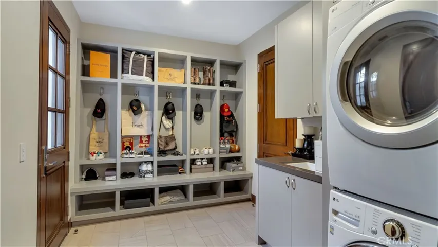 Wondering what to do with all the shoes, hats and backpacks? The first of 2 laundry areas provides storage for all of it.