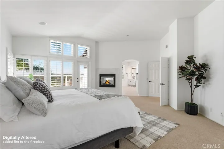 Primary Bedroom with Plantation Shutters & Fireplace