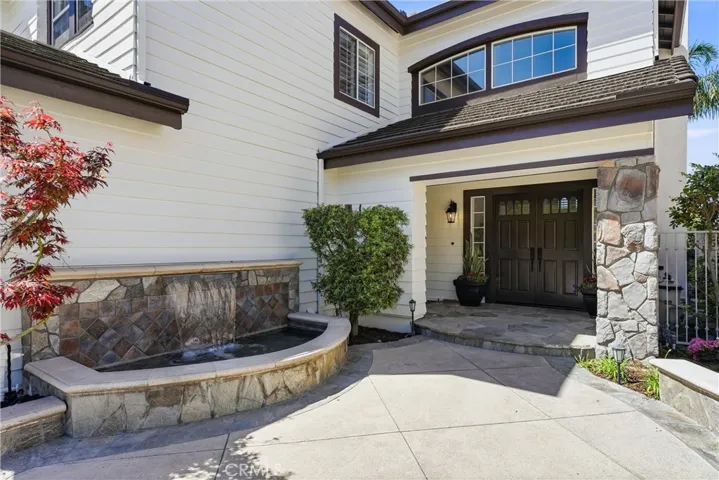 Inviting Front Porch Entry with Water Feature