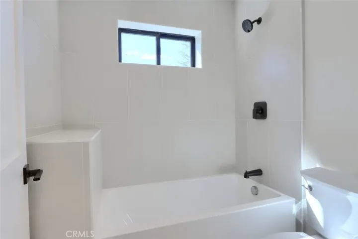 Upstairs secondary bath toilet/tub/shower room