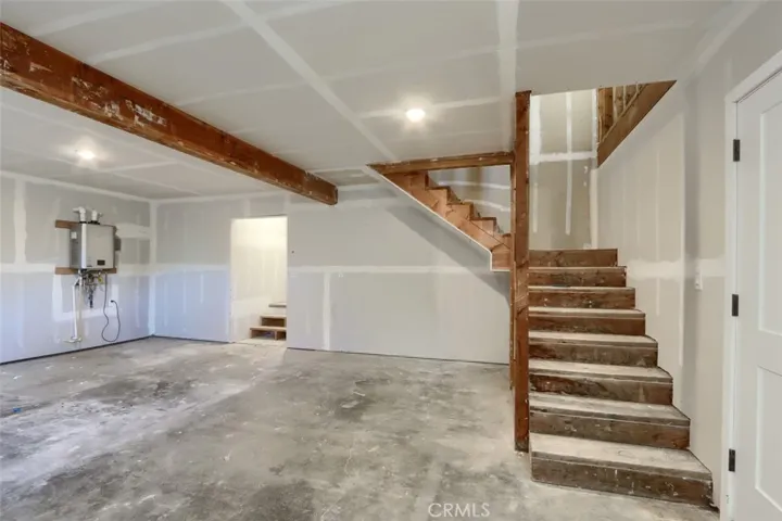 Stairs leading to upstairs unfinished area
