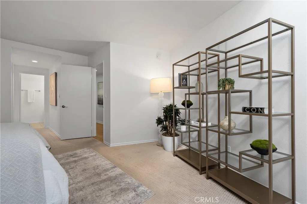 Second bedroom suite complete with its own walk in closet and full bath with enclosed shower and water closet, offering flexibility for guests, extended stays, or creative pursuits.