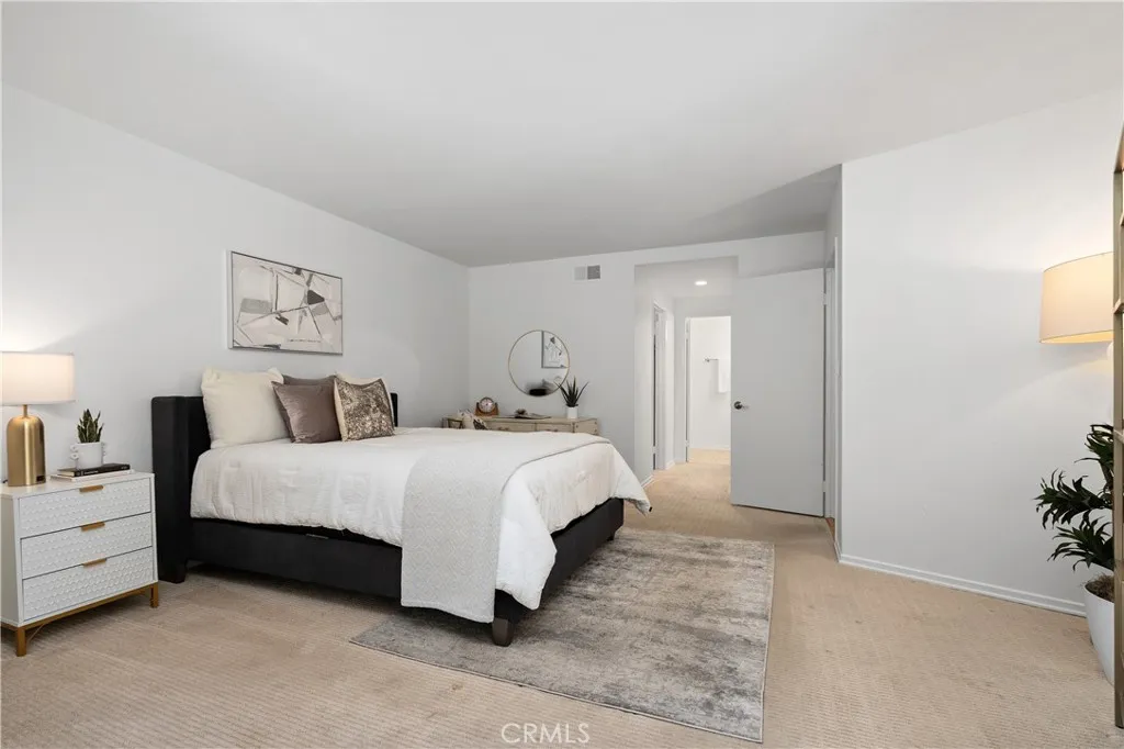 Second bedroom suite complete with its own walk in closet and full bath with enclosed shower and water closet, offering flexibility for guests, extended stays, or creative pursuits.