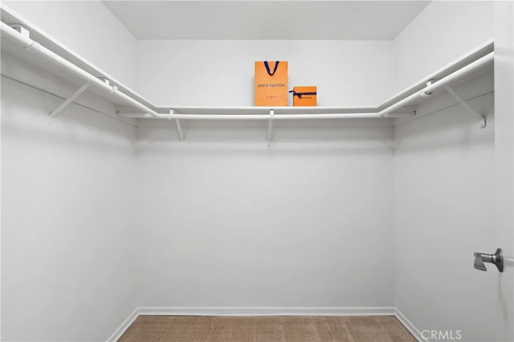 Second bedroom suite with walk-in closet.