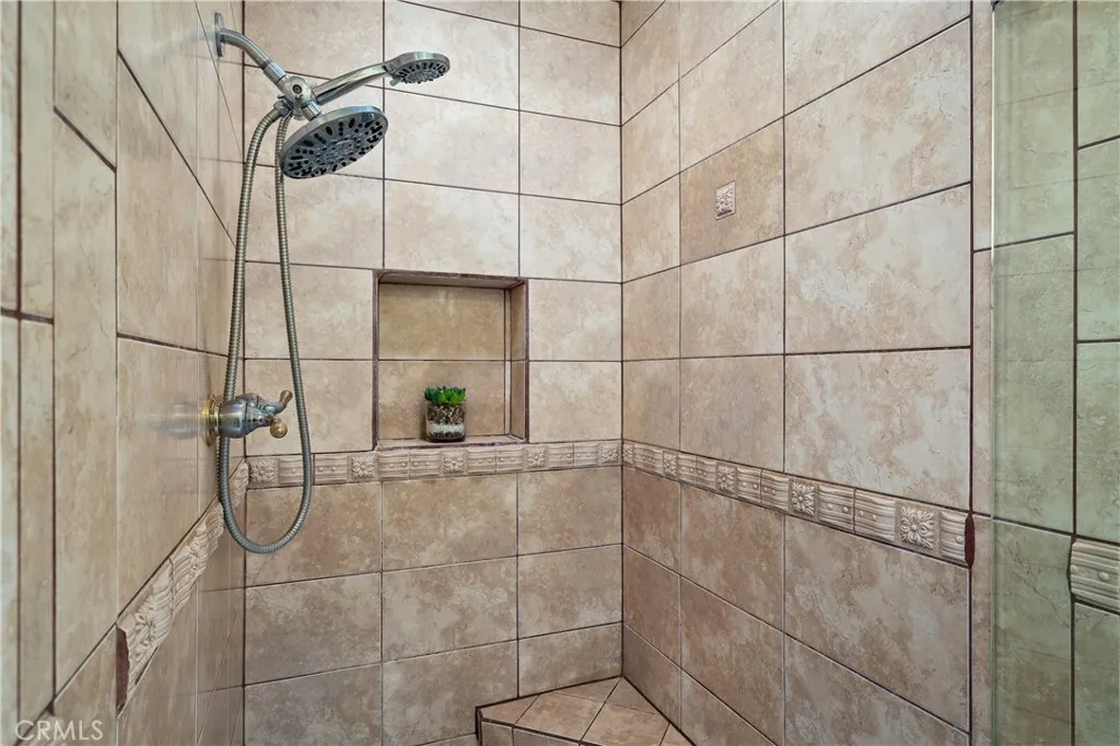 Primary bedroom includes the separate shower area and private water closet.