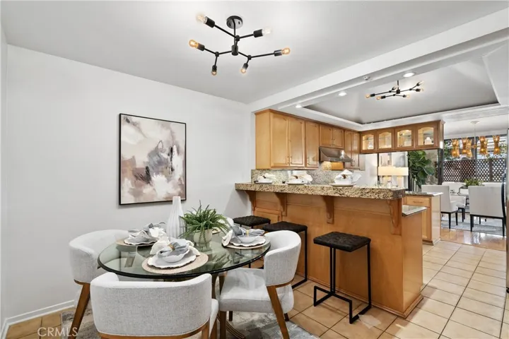 Multi purpose nook with breakfast bar seating, a built in work desk, and flexible space ideal for a home office, creative studio, or casual dining.