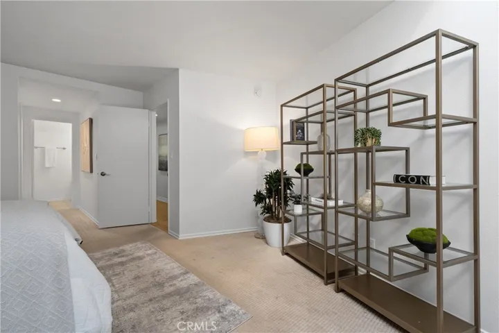 Second bedroom suite complete with its own walk in closet and full bath with enclosed shower and water closet, offering flexibility for guests, extended stays, or creative pursuits.