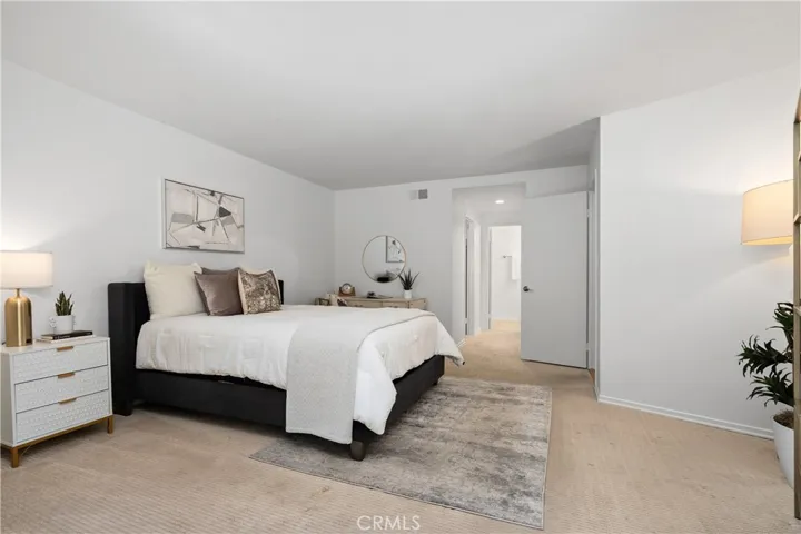 Second bedroom suite complete with its own walk in closet and full bath with enclosed shower and water closet, offering flexibility for guests, extended stays, or creative pursuits.