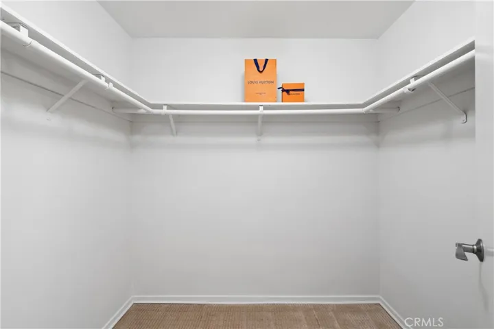 Second bedroom suite with walk-in closet.
