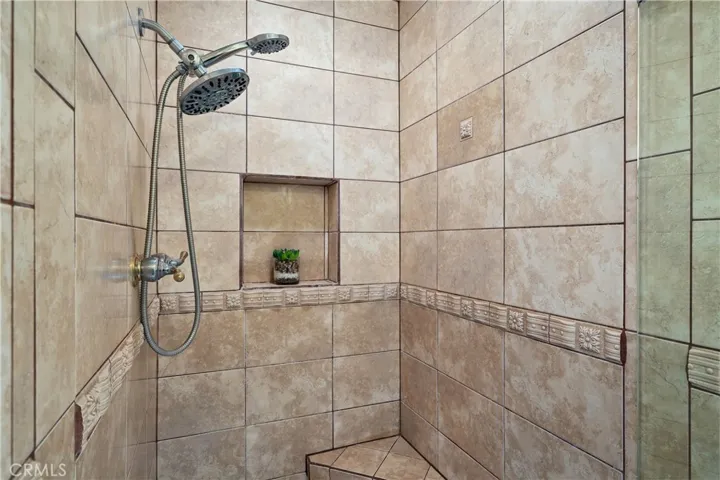 Primary bedroom includes the separate shower area and private water closet.