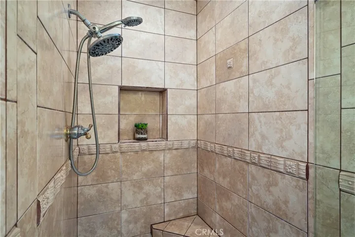 Primary bedroom includes the separate shower area and private water closet.