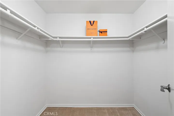 Second bedroom suite with walk-in closet.