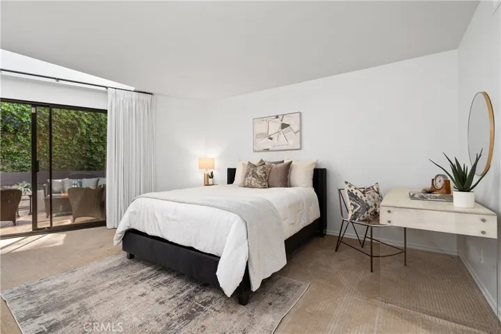 Second bedroom suite complete with its own walk in closet and full bath with enclosed shower and water closet, offering flexibility for guests, extended stays, or creative pursuits.