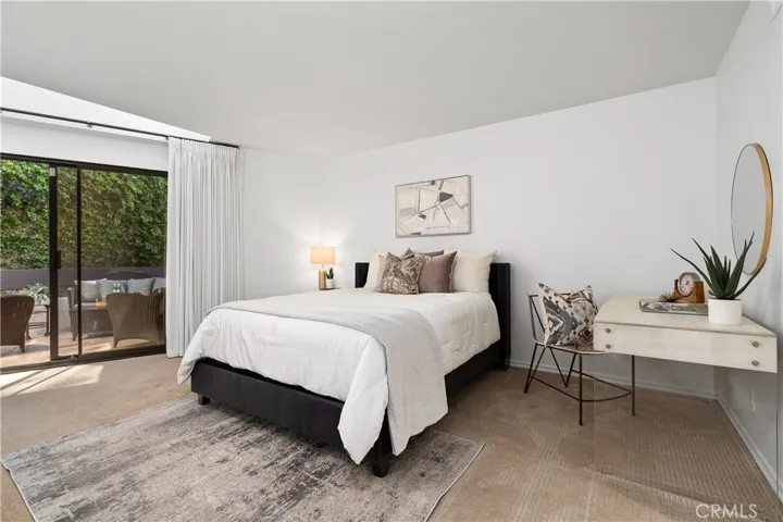 Second bedroom suite complete with its own walk in closet and full bath with enclosed shower and water closet, offering flexibility for guests, extended stays, or creative pursuits.