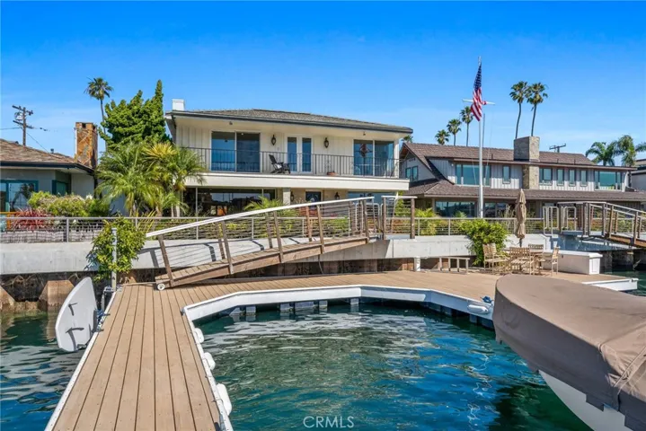 Welcome to 5585 E Corso di Napoli on Treasure Island, Naples/Long Beach. Newer dock with large sitting/entertaining area dock that can accommodate multiple boats and your water toys