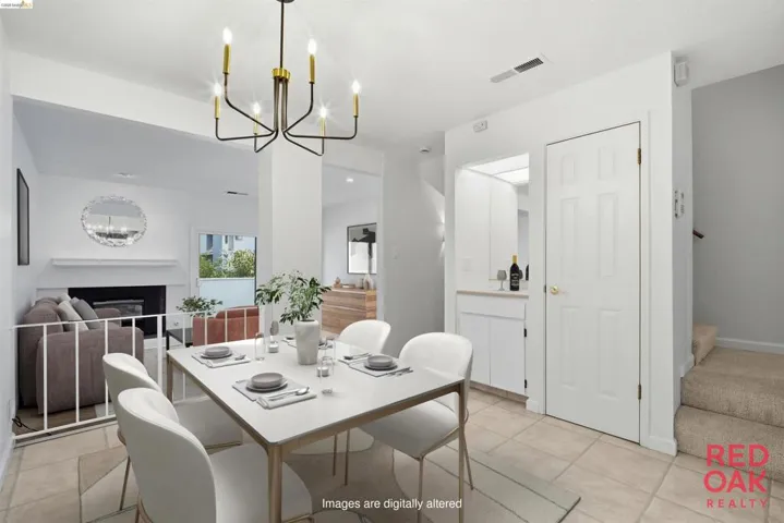 Dining room with hanging lights, a fireplace, and light tile patterned floors